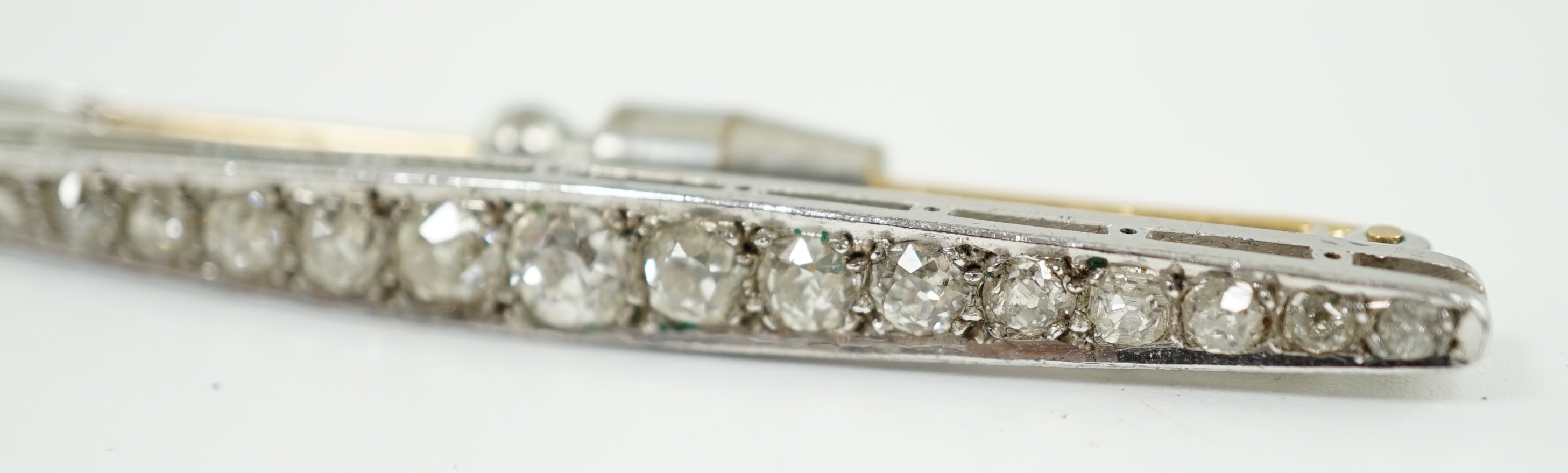 An early to mid 20th century platinum and graduated eighteen stone diamond set bar brooch